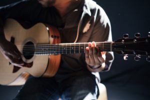 Playing Acoustic Guitar