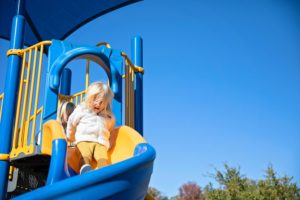 Child On A Slide