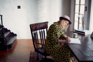 Woman Writing at a Desk